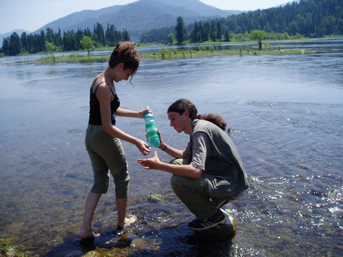 GASU students taking a water sample from Lake Teletskaya